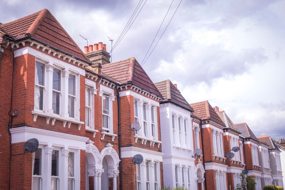 A row of typical brick terraced houses in London
